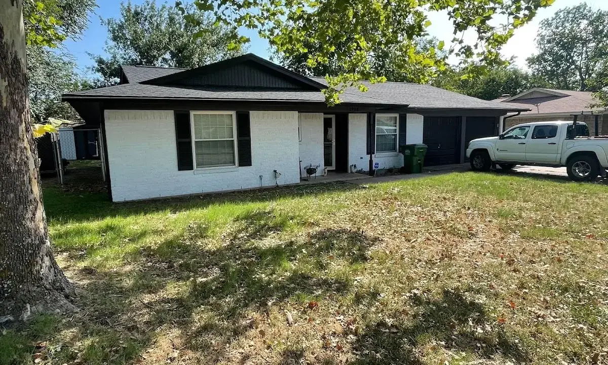 Professional roofing crew working on a residential roof in Cornwall